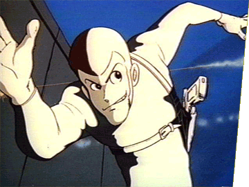 Lupin the Third, as seen in Part 1, running from the police at night while searchlights are pointing at him